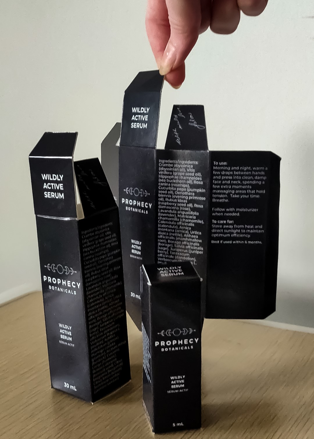Posed shot of the final design for the two products I designed the packaging for. On the top, there is text to help know which product it is when stacked in a shelf space-saving manner. On the minor flap, there is a handwritten message from the brand owner